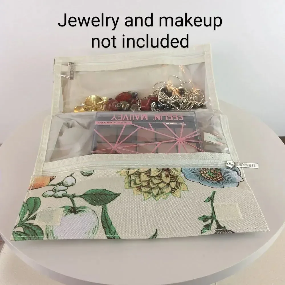 Clinique cream floral print fold over makeup / jewelry bag.